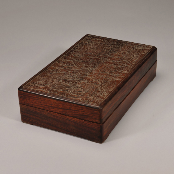 Scholar’s objects set in a case with cloud and crane patterns